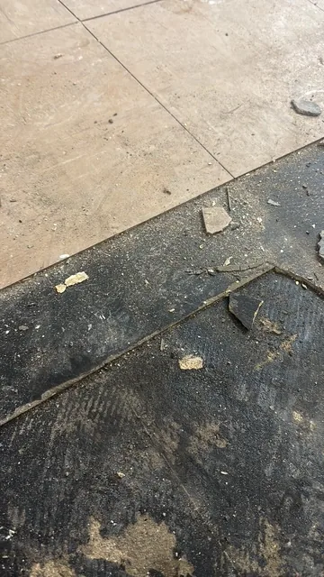 Black bitumen mastic floor removal in a SE11 flat